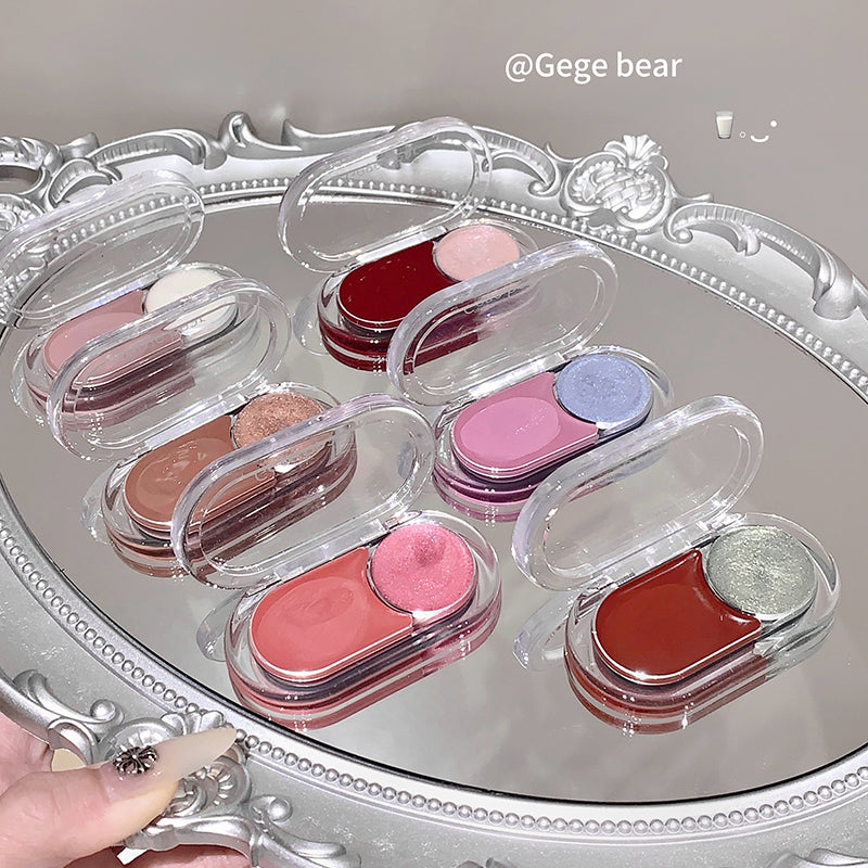 Set of small makeup cases with lip products on a decorative tray.
