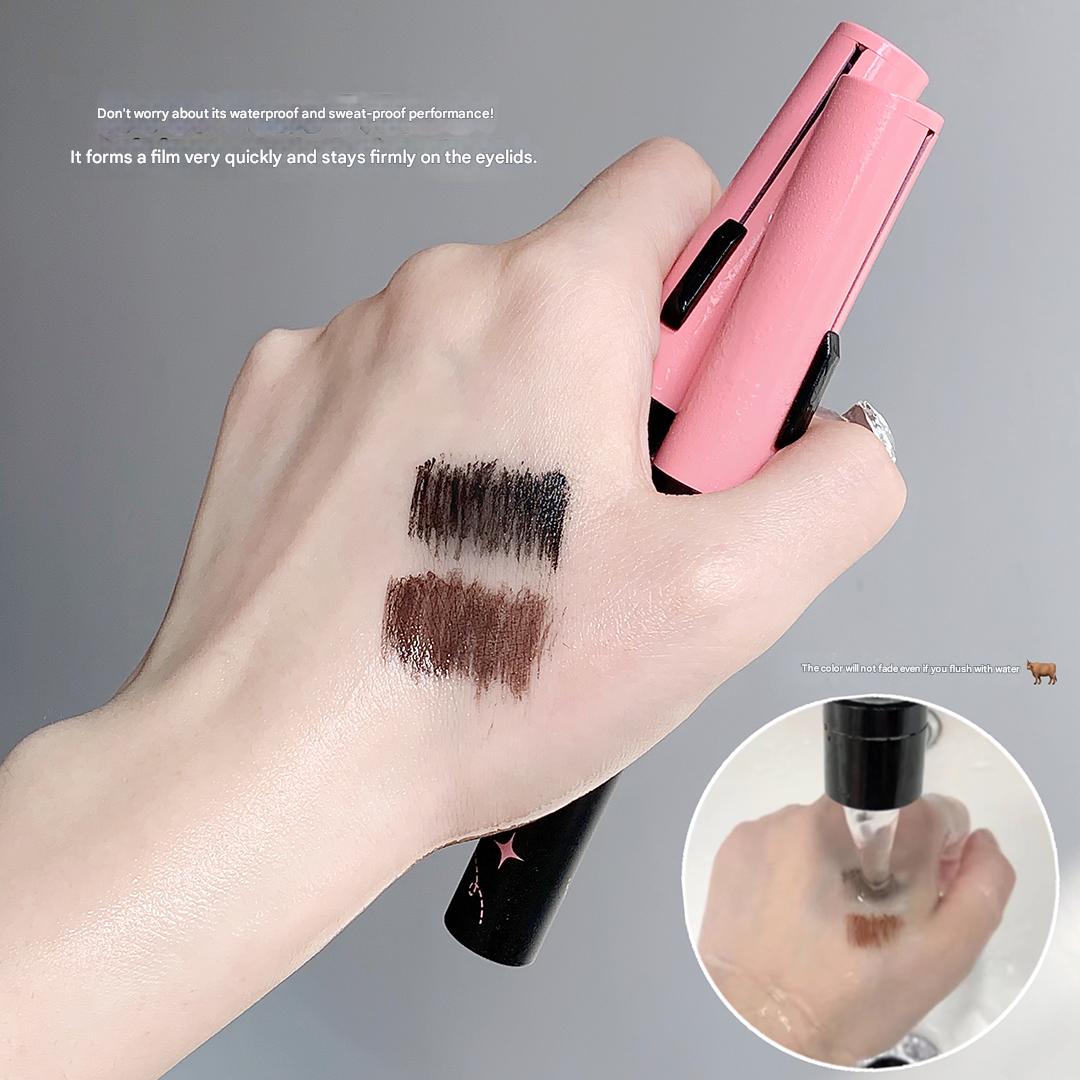 Hand holding a pink makeup product with swatches on skin and close-up of cap.