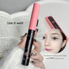 Pink and black eyelash curler with a close-up of an eye wearing false eyelashes, on a book background.