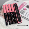 Set of pink and black mascara with packaging on a white surface