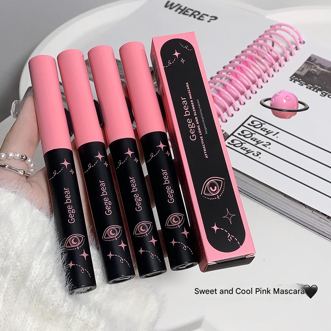 Set of pink and black mascara with packaging on a white surface