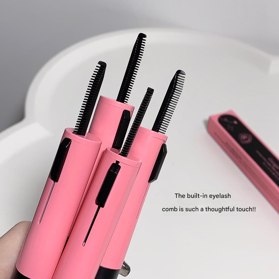 Pink eyelash curler with built-in comb on a white surface