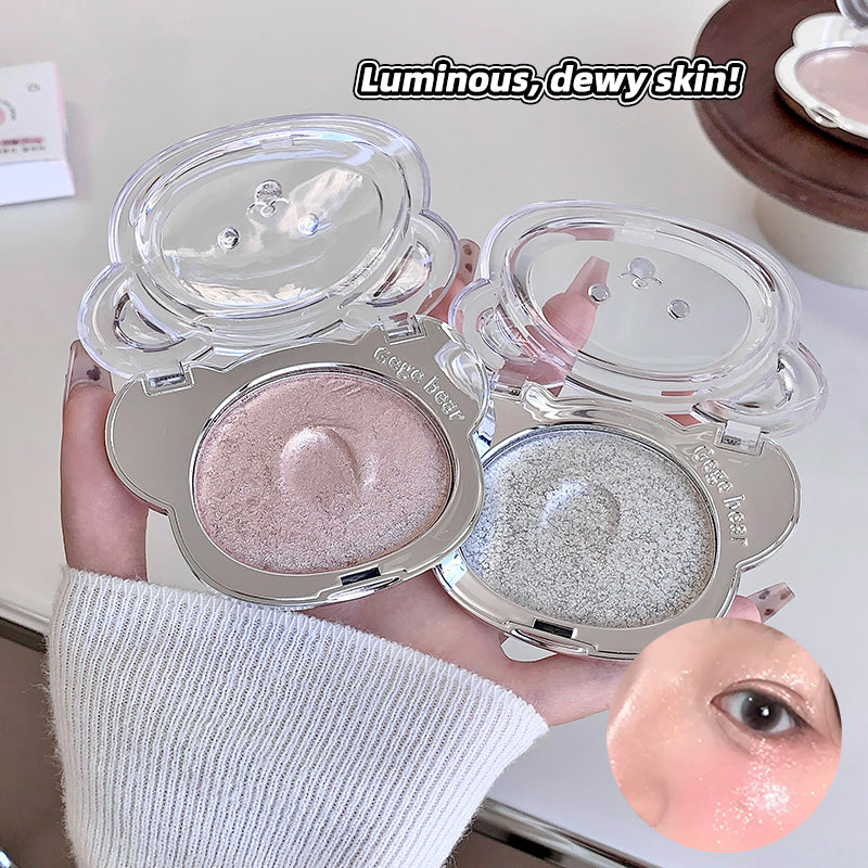 Two makeup compact powders with a close-up of a person's eye wearing the product, labeled 'Luminous, dewy skin!'.