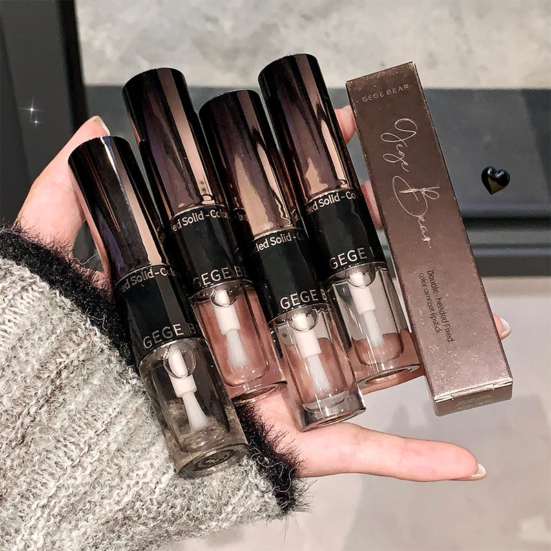 Hand holding GECE lip glosses and packaging with a blurred background