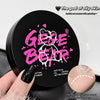 Setting powder container with 'Gee E Bear' branding and a hand holding a sample of the powder.