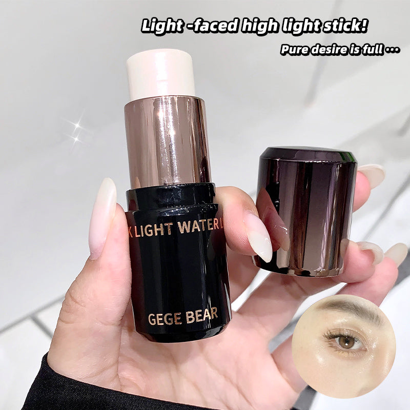 Hand holding a GEGE BEAR cosmetic stick with a close-up of the product on a light background