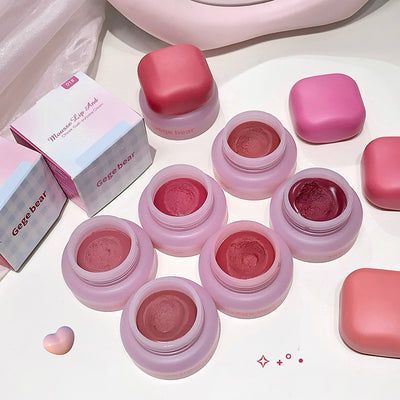 Pink lip products with 'Gege bear' branding on a light background