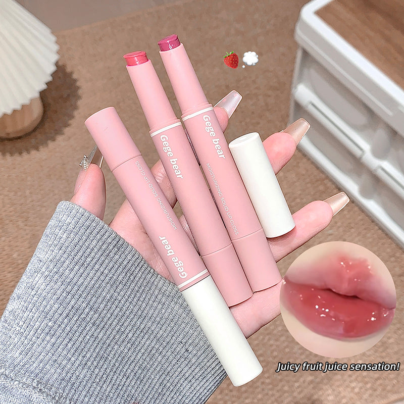 Pink lip glosses with a close-up of a glossy lip and text 'Juicy fruit juice sensation!' on a neutral background.