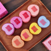 Heart-shapedGE GE BEAR products on a wooden tray