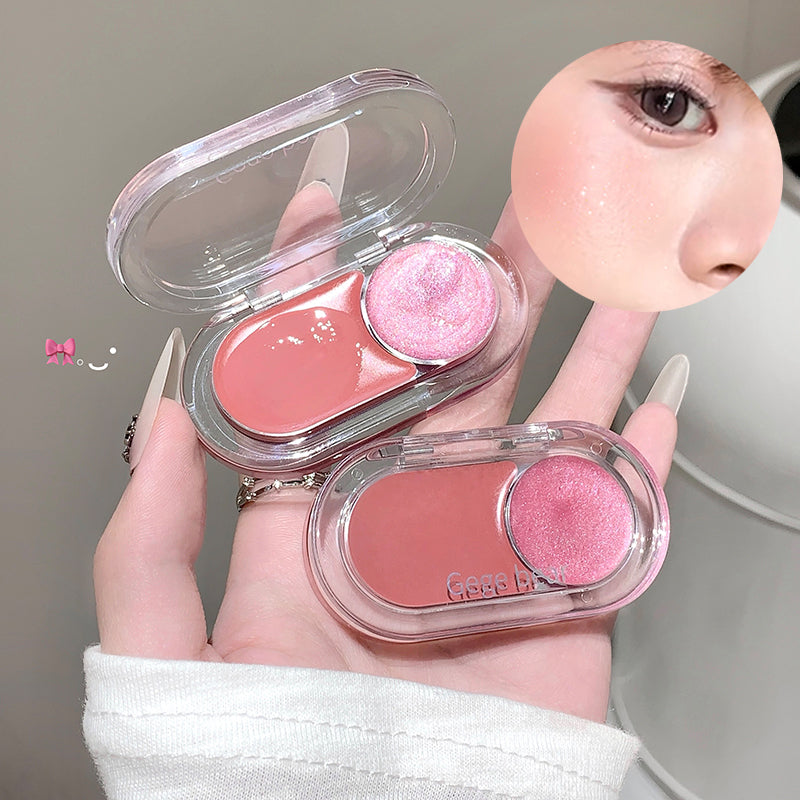 Two pink makeup products in clear cases held by a hand against a neutral background.