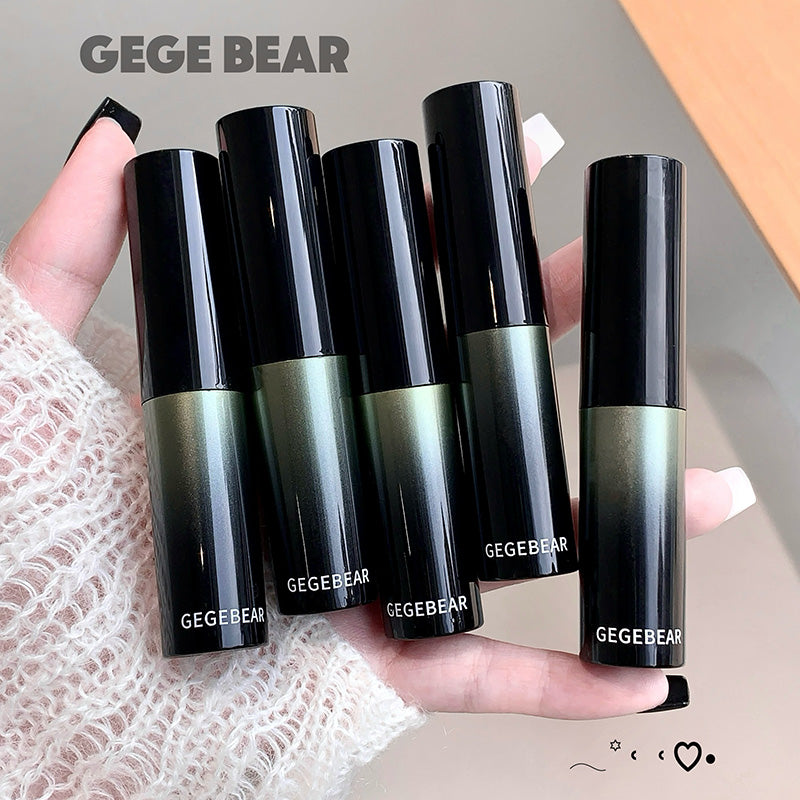 Five black and green GEGBEAR lipsticks held in a hand against a neutral background.
