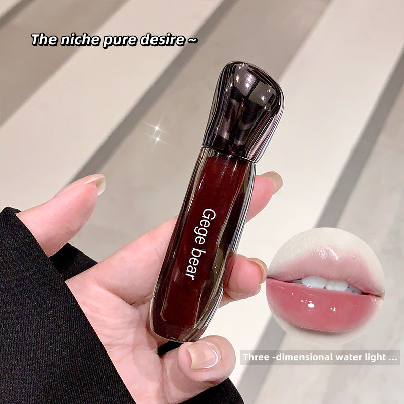 Hand holding a red lip gloss with 'Gege bear' branding, showing a close-up of the product.