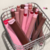Basket filled with pink and brown lipsticks labeled 'Gege Bear' on a light background.