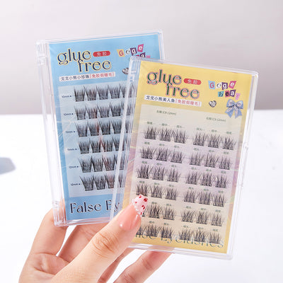 False eyelashes packaging with 'glue free' label held by a hand.