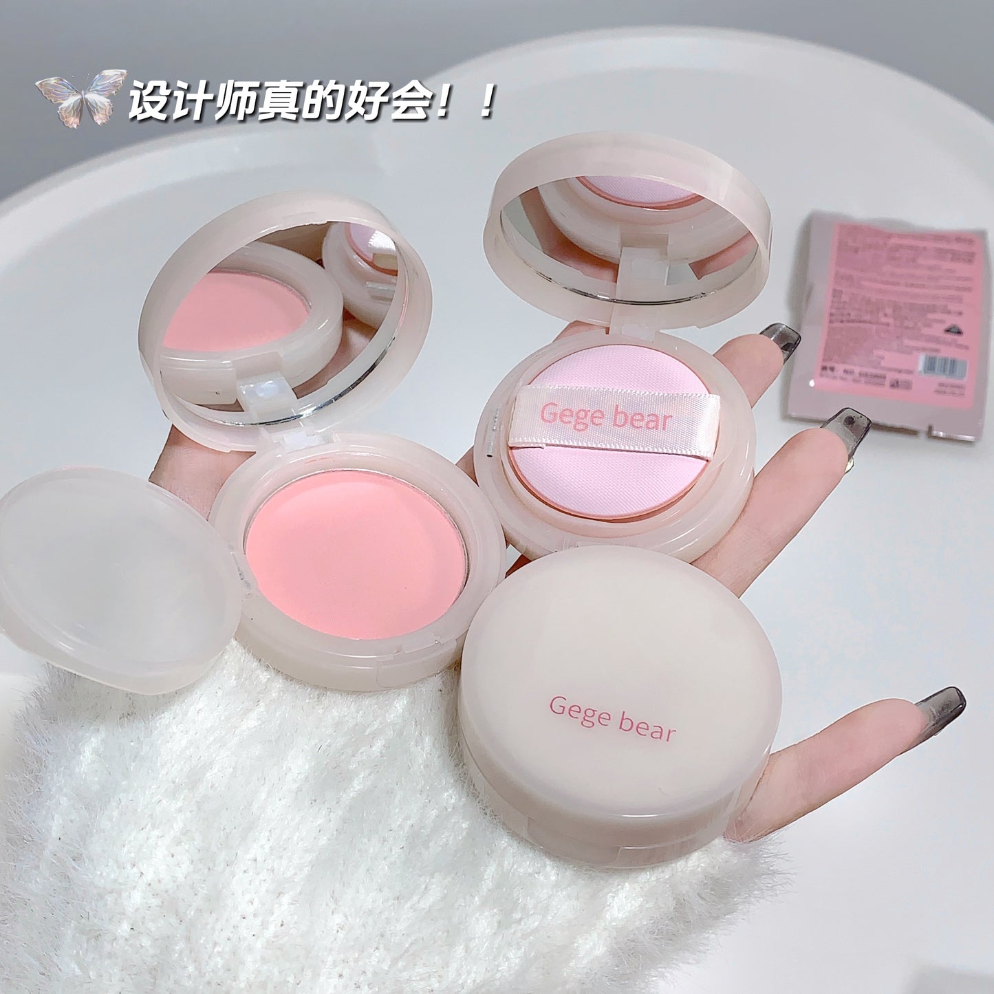 Pink makeup compact with 'Gege bear' branding on a white surface.