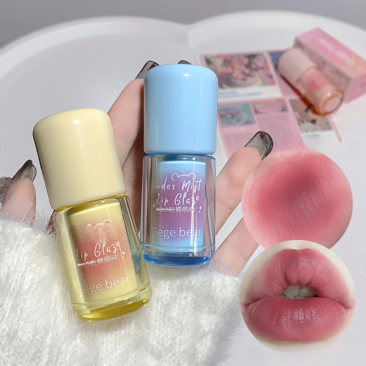 Two nail polish bottles and a lip gloss on a textured surface with a close-up of lips.