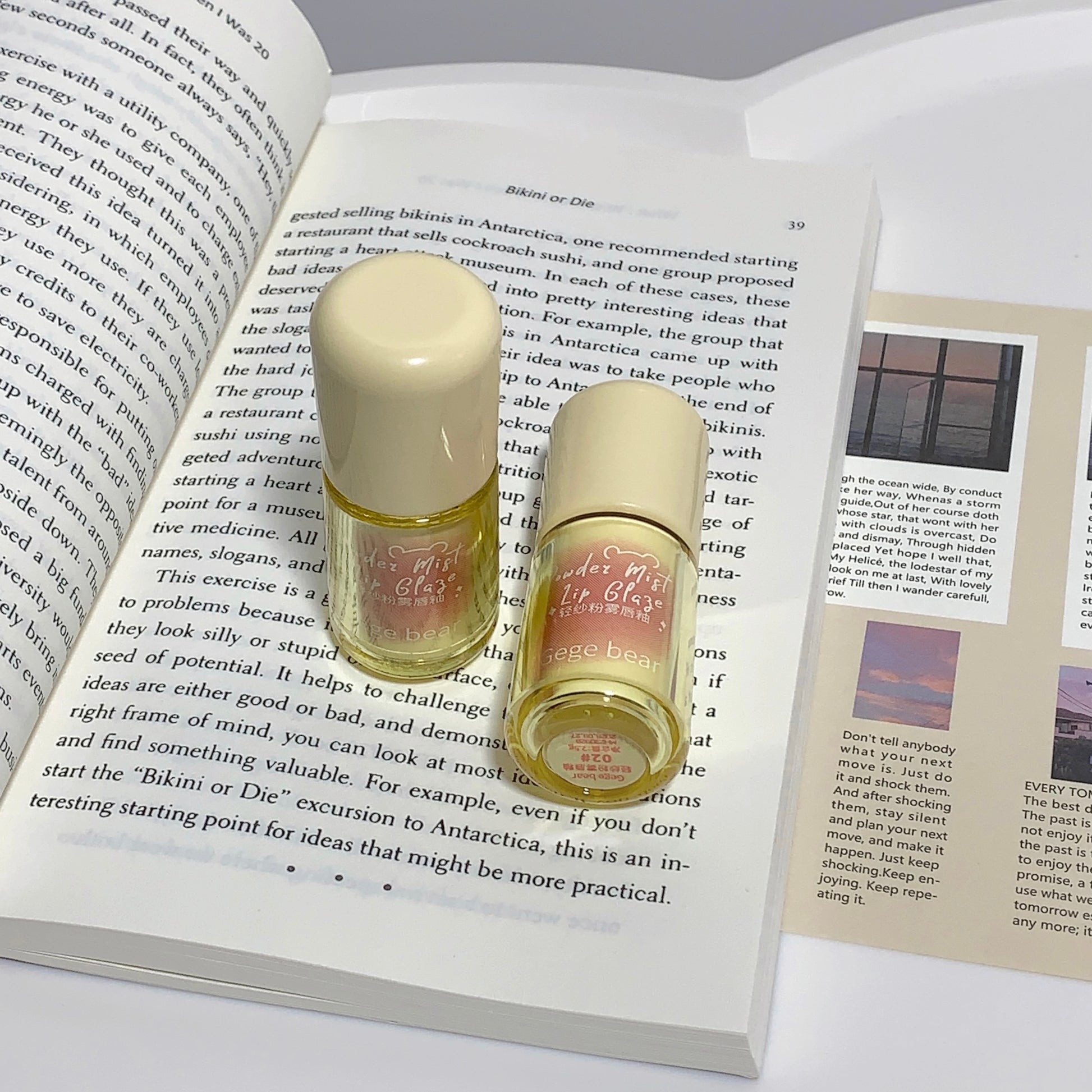 Two lip balm tubes on an open book