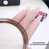 Hand with beige nail polish holding a makeup compact, with text describing the powder's texture.
