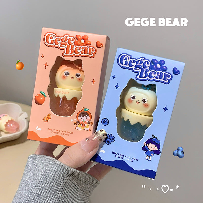 Two GEGE BEAR product boxes held by a hand on a neutral background