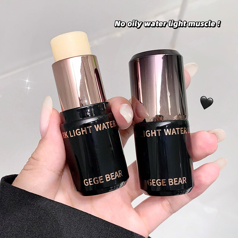 Two black cosmetic sticks with gold caps held in a hand, branded 'GEGE BEAR'.