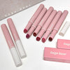 Pink lip glosses with white caps on a white surface, featuring 'Gege bear' branding.