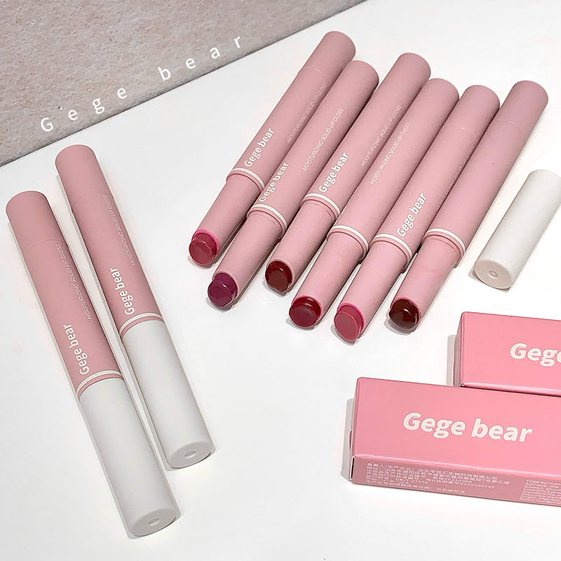 Pink lip glosses with white caps on a white surface, featuring 'Gege bear' branding.