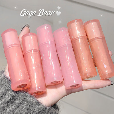 Set of pink lip balms on a hand with 'Gege Bear' branding.