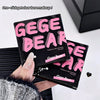 Two Gege Bear makeup products held by a hand on a white background