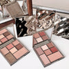 Makeup palettes with 'Gypset' branding on a reflective surface
