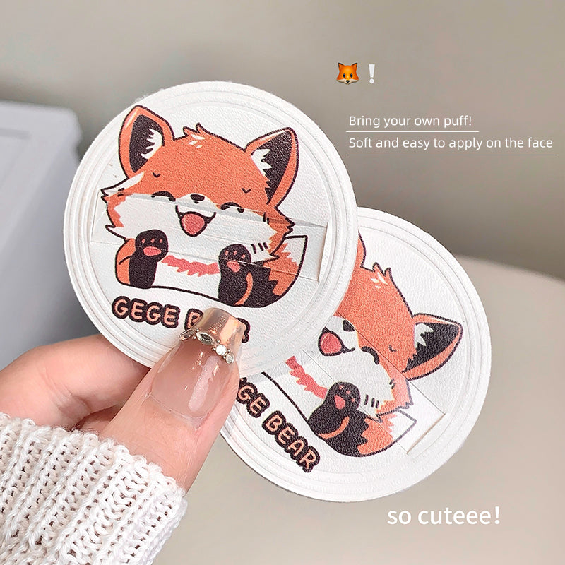 Two GEGE BEAR face wipes with a hand holding one, on a neutral background.