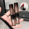 Two GEGE BEAUTY lipsticks held in a hand with a blurred background