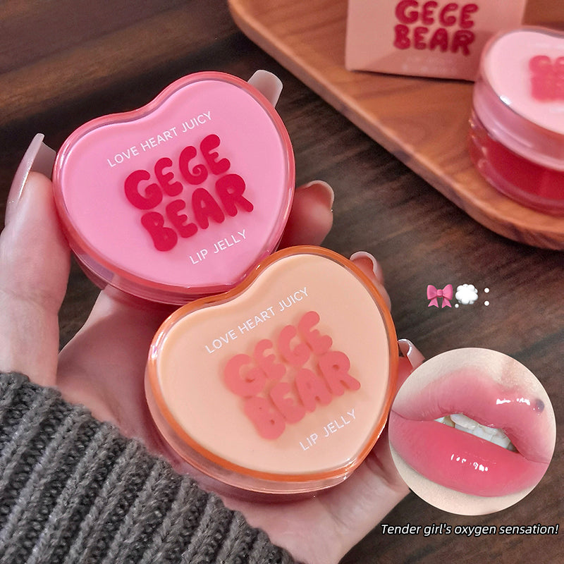 Heart-shaped lip jelly containers with 'GEGE BEAR' branding on a wooden surface.