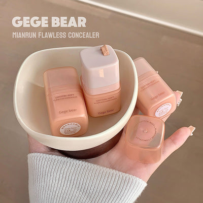 GEGE BEAR Mianrun Flawless Concealer bottles in a bowl held by a person.