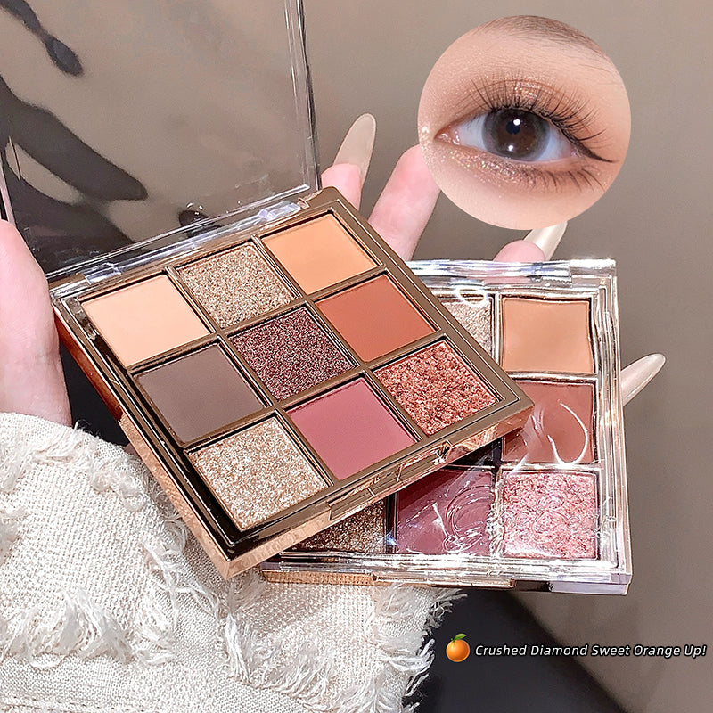 Makeup palette with eyeshadow shades held by a hand, with a close-up of an eye wearing the makeup.