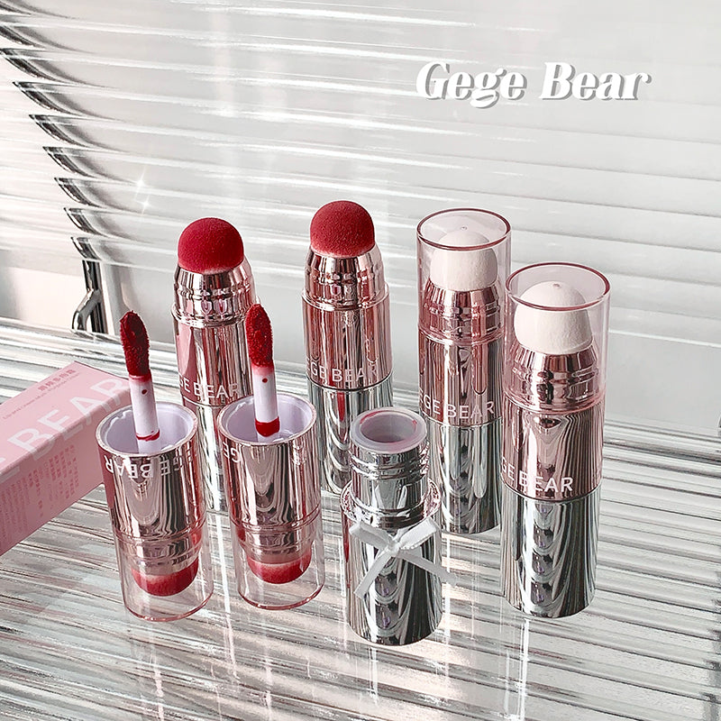 Set of Gege Bear lipsticks on a reflective surface with a blurred background