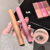 Two makeup products held by a hand with an inset of an eye wearing the product.
