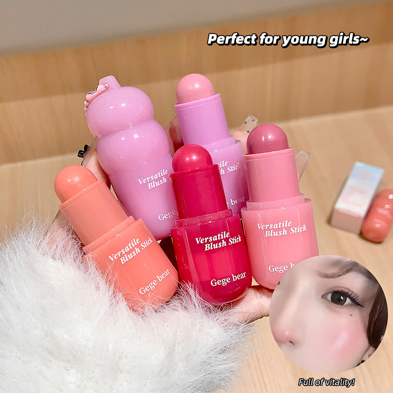 Set of pink blush sticks with 'Gege bear' branding on a wooden surface.