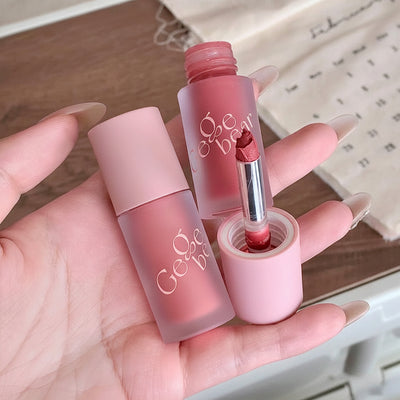 Two pink lip products with 'Gooseberry' branding held in a hand.