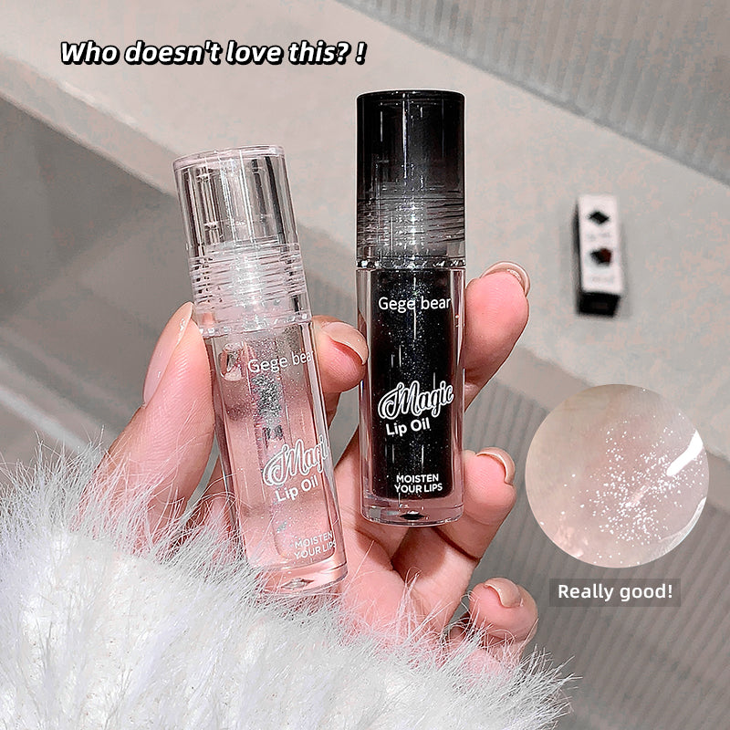 Two lip oil bottles held in a hand with text and close-up of oil.