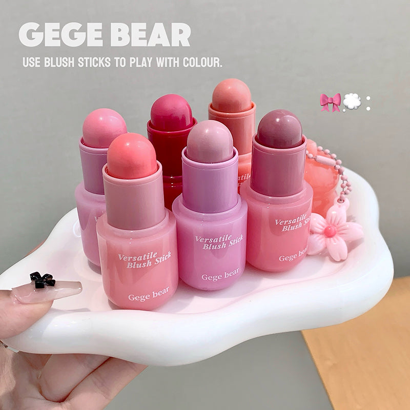Pink blush sticks with 'GEGE BEAR' branding on a white stand.