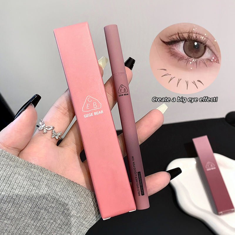 Pink eyeliner pen and case held by a hand, with an inset of an eye wearing the product.