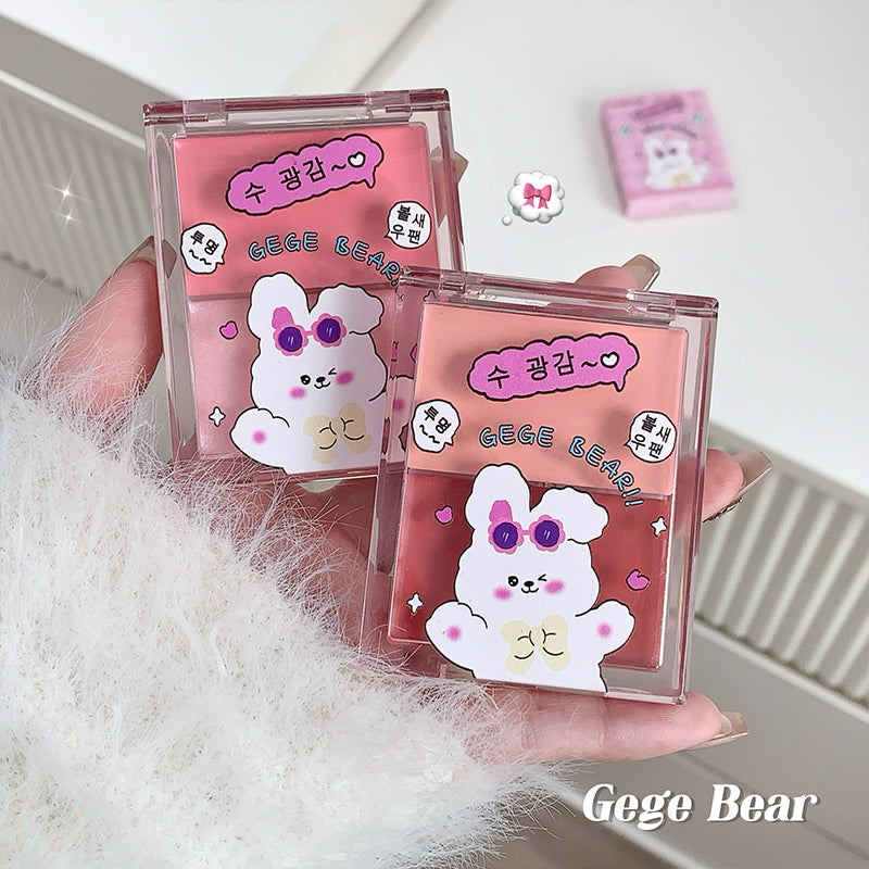 Two pink cases with a cartoon bear design held by a hand on a white background.