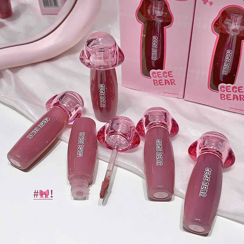Pink lip gloss with 'GEGE BEAR' branding on a white background