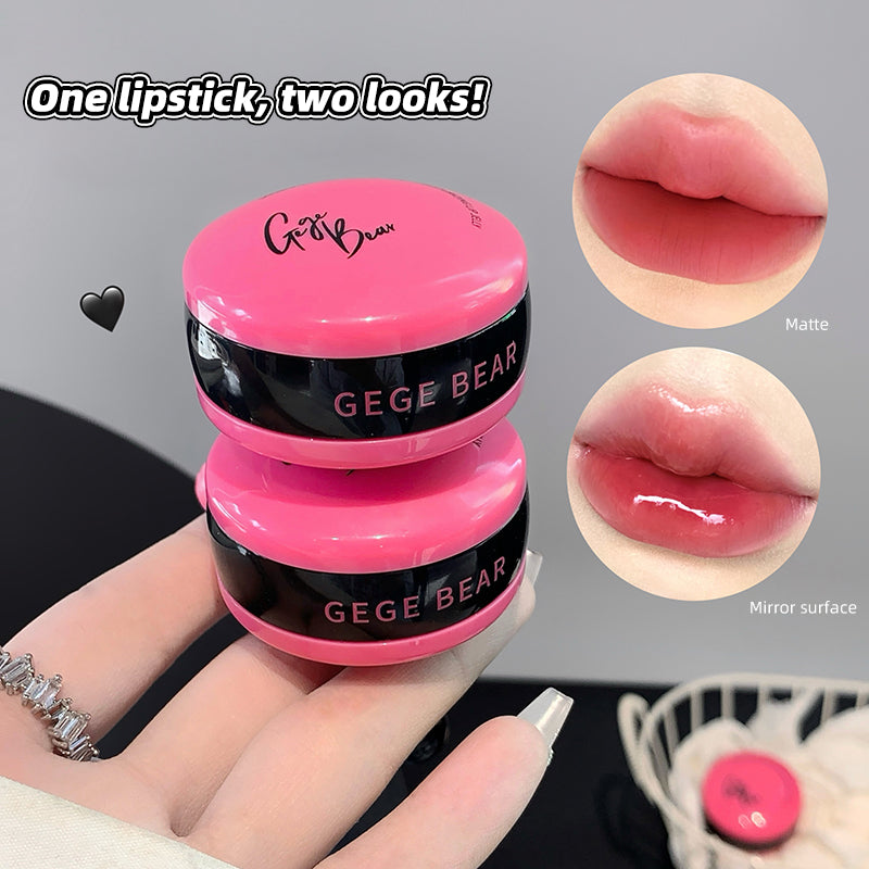 Pink lipstick with 'GEGE BEAR' branding, showing matte and mirror surface on lips.