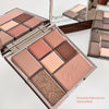 Makeup palette with various shades of makeup on a white background
