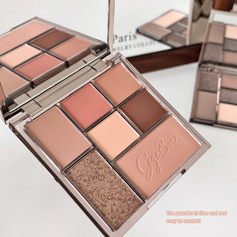 Makeup palette with various shades of makeup on a white background