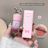 Pink lip balm and packaging held by a hand with 'Sweet feeling of summer!' text.