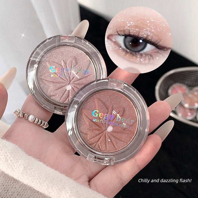 Two compact makeup products with 'Geege bear' branding held in a hand, with an eye wearing glittery makeup in the corner.