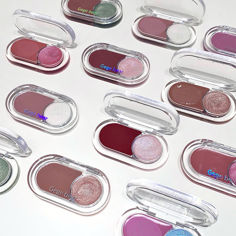 Collection of small makeup compact cases with colorful shades on a white background