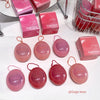 Pink cosmetic products with 'Gege bear' branding on a white surface.